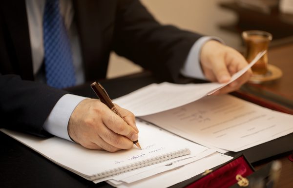 Businessman signing important contract papers. High quality photo